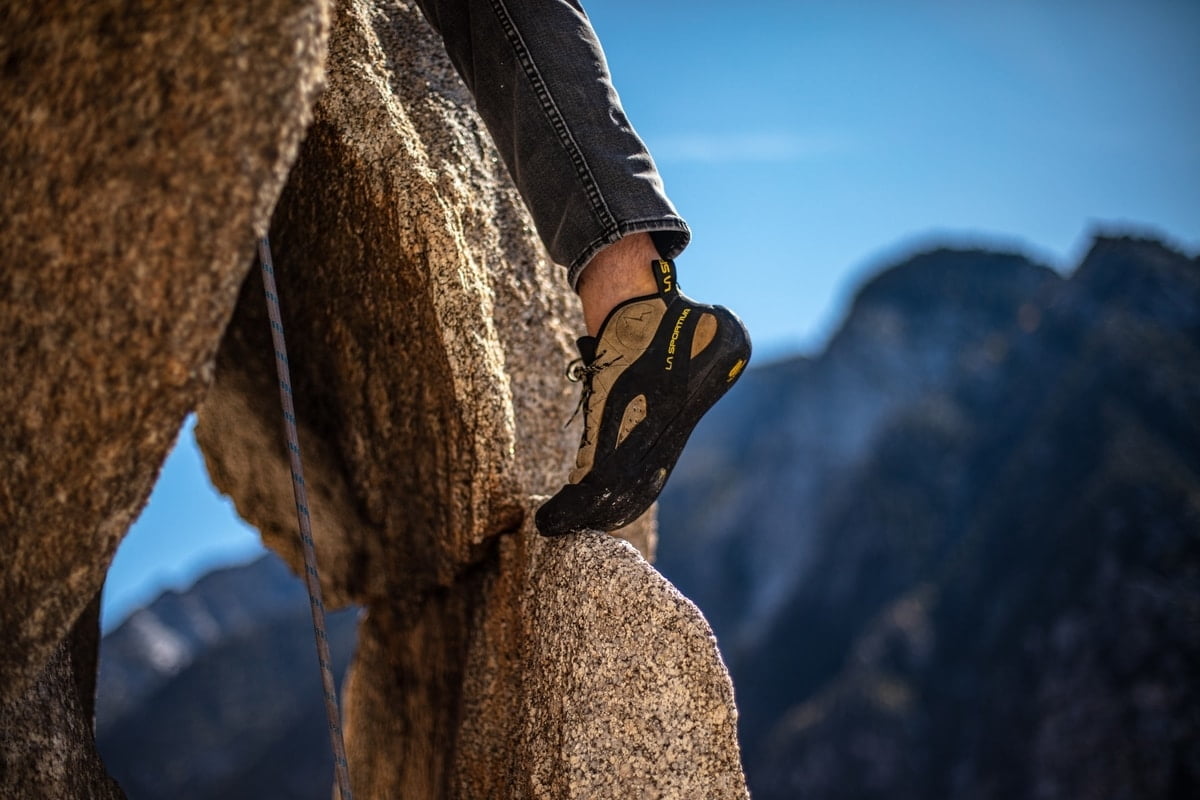 person-rock-climbing-shoe