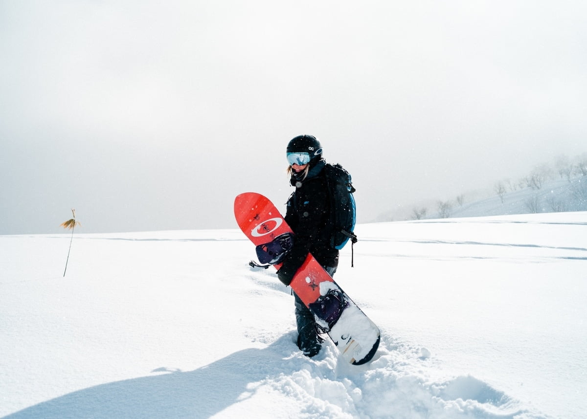 winter-landscape-person-holding-snowboard-pockets