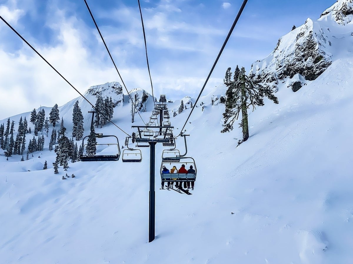 Ski lifts over snowy mountains