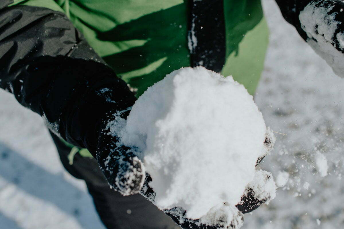 snowball in winter ski gloved hand