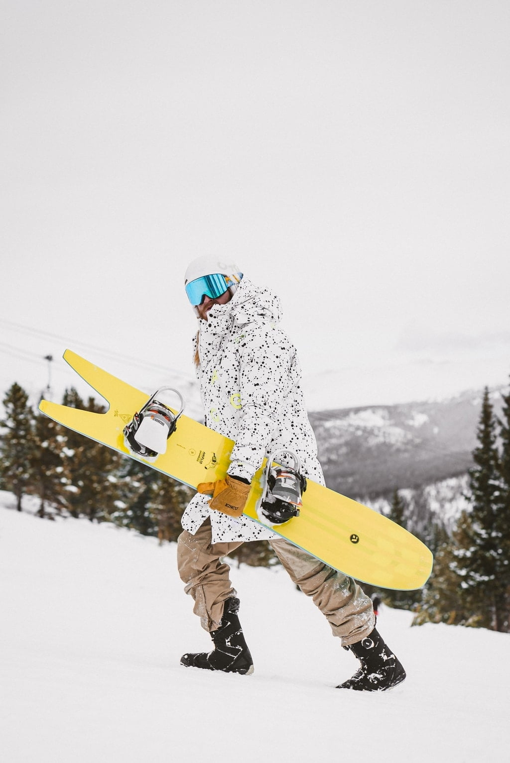 Man walking with a snowboard
