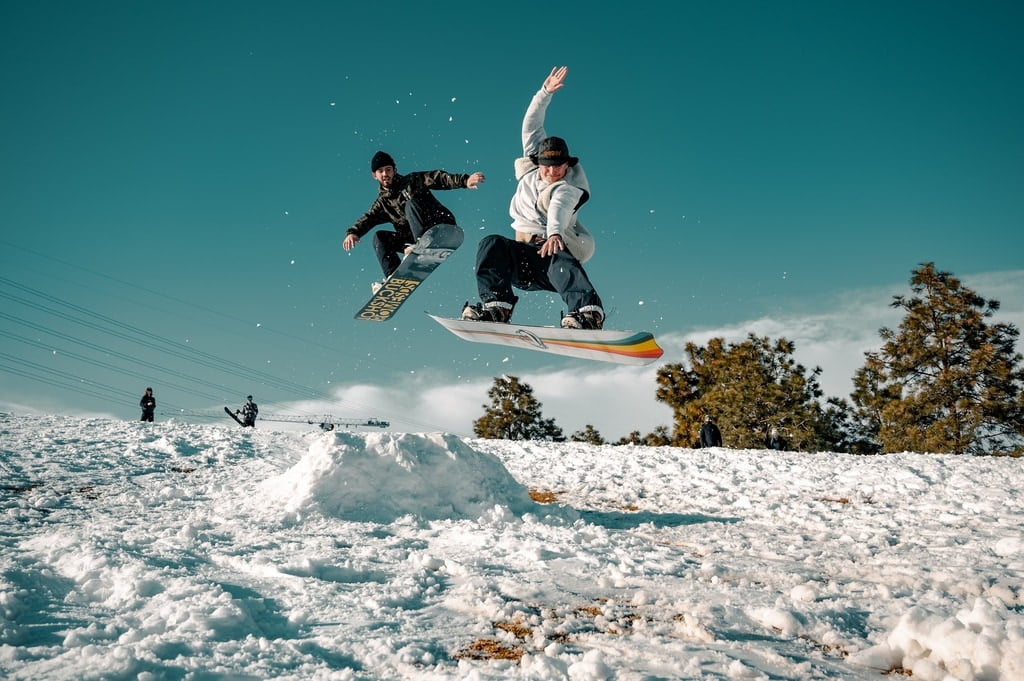 Two men snowboarding